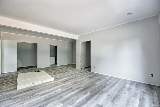 unfurnished living room featuring light wood-type flooring