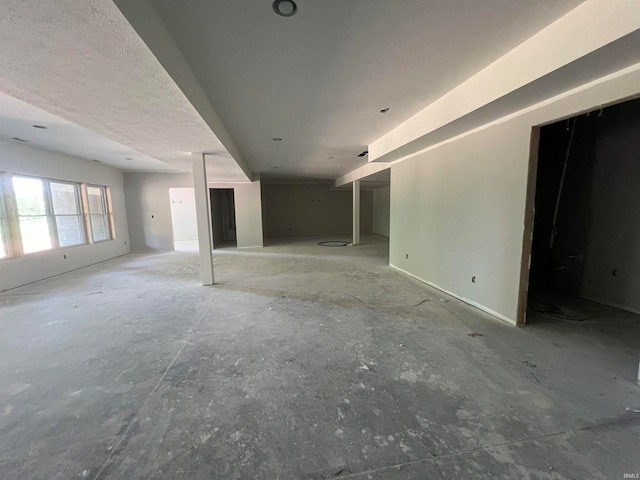 unfurnished living room with a textured ceiling