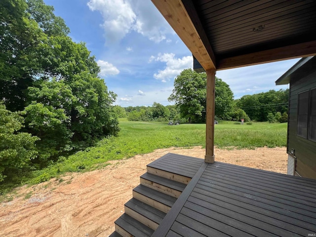 wooden deck with a yard