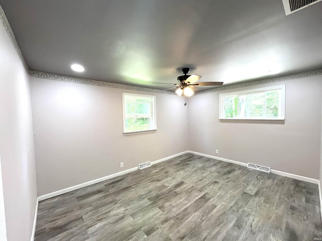 unfurnished room with hardwood / wood-style floors and ceiling fan