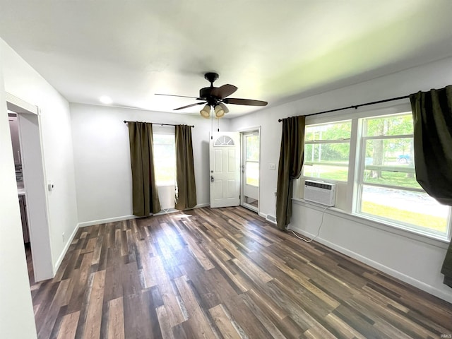 unfurnished room with dark wood-type flooring and ceiling fan