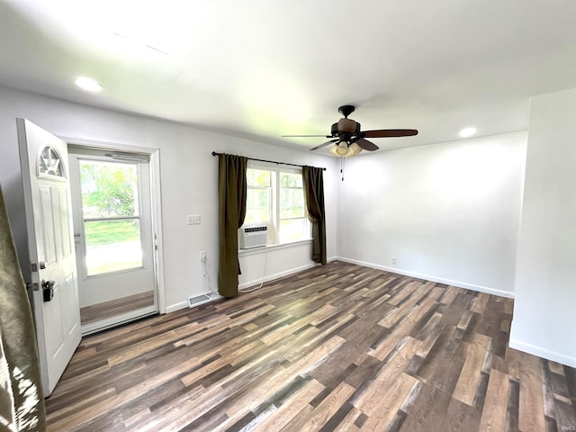 unfurnished room featuring ceiling fan and dark hardwood / wood-style floors