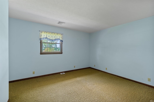 unfurnished room featuring carpet flooring