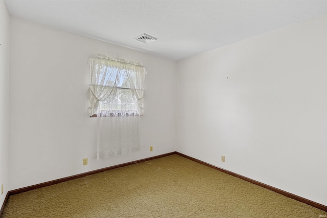 unfurnished room with carpet flooring