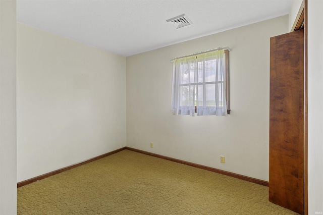 empty room with light colored carpet