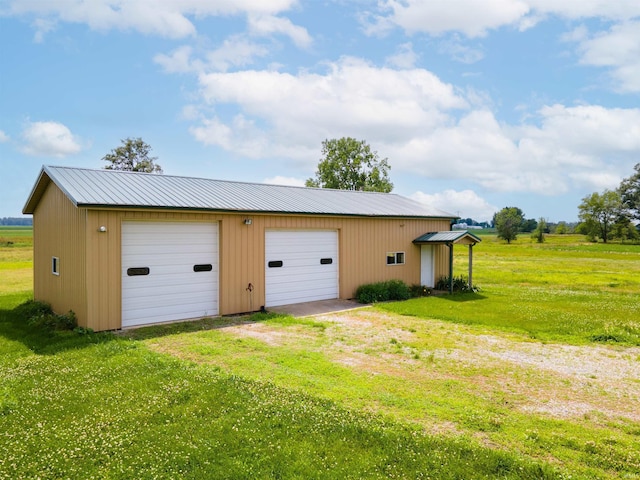 garage with a yard