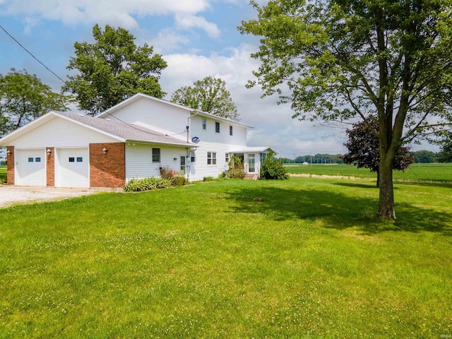 view of front facade with a front yard and a garage