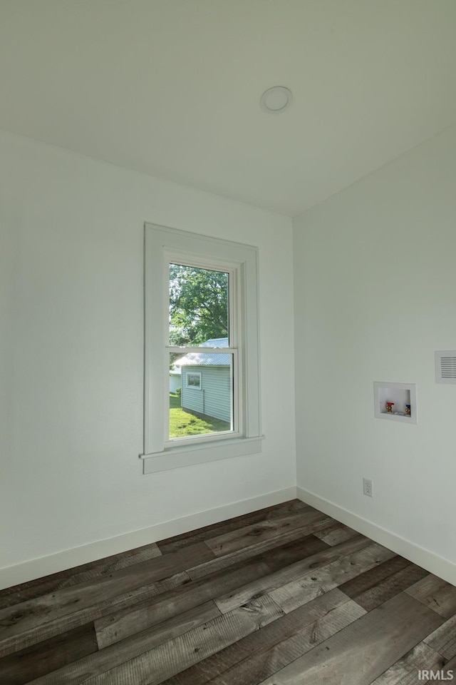 empty room with dark wood-type flooring