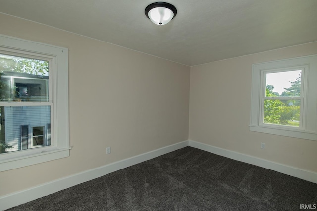 empty room with carpet flooring