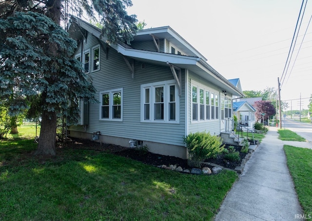 view of property exterior featuring a yard