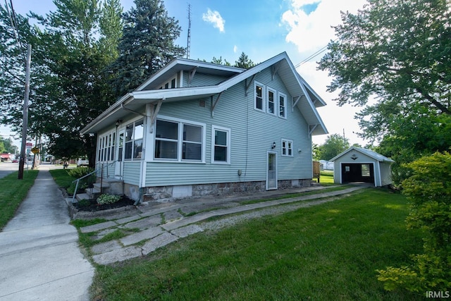 view of side of property featuring an outdoor structure, a lawn, and a garage