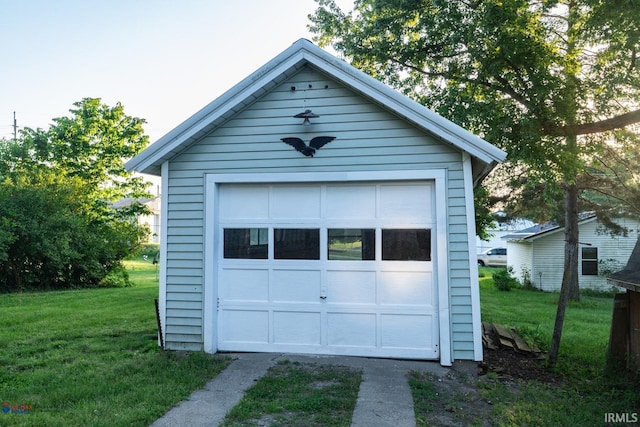 garage featuring a yard