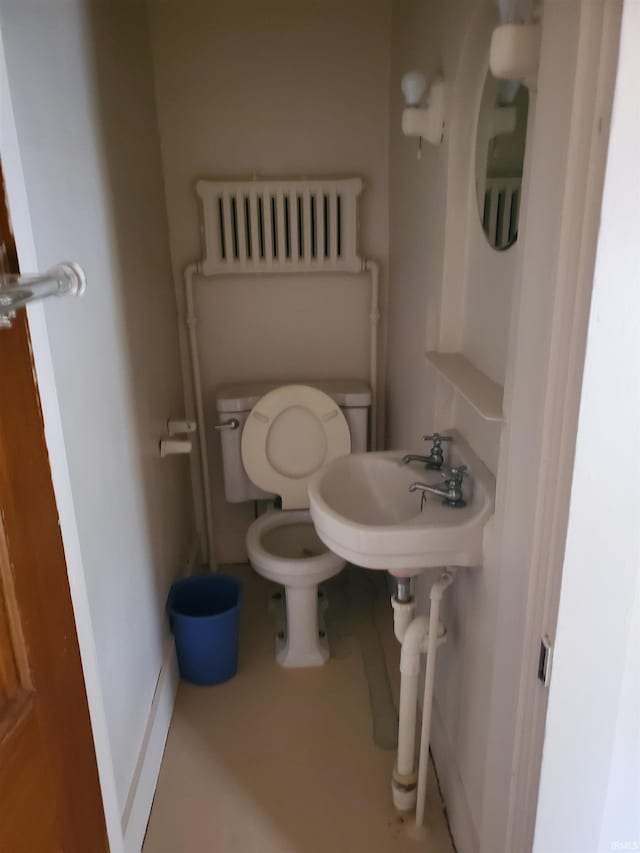 bathroom with toilet and radiator