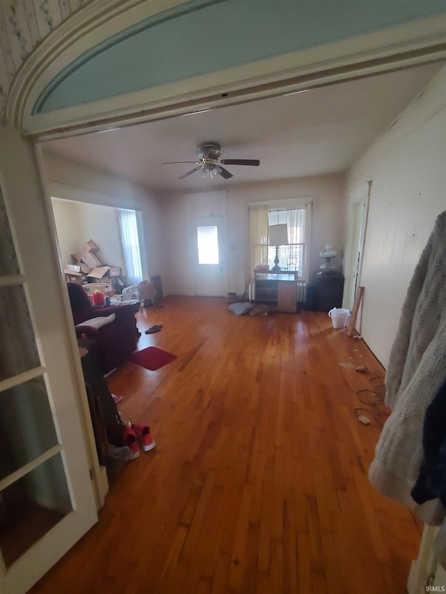 living room featuring hardwood / wood-style flooring and ceiling fan