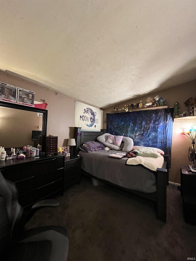 carpeted bedroom featuring a textured ceiling