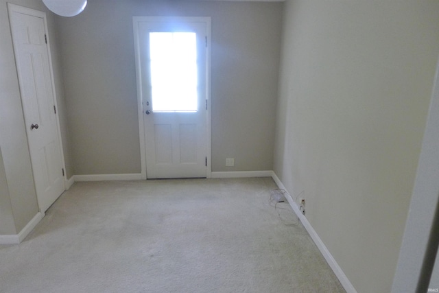 interior space featuring light colored carpet