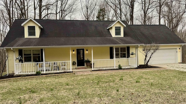 0 N State Road 450, Shoals, IN 47581 - cape cod house with a porch, a garage, concrete driveway, and a front yard