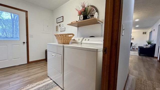 0 N State Road 450, Shoals, IN 47581 - laundry room featuring light wood-style flooring, washing machine and dryer, a textured ceiling, and baseboards
