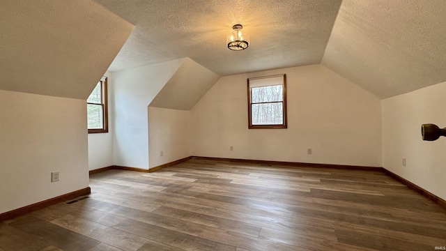 0 N State Road 450, Shoals, IN 47581 - additional living space featuring a textured ceiling, wood-type flooring, lofted ceiling, and baseboards