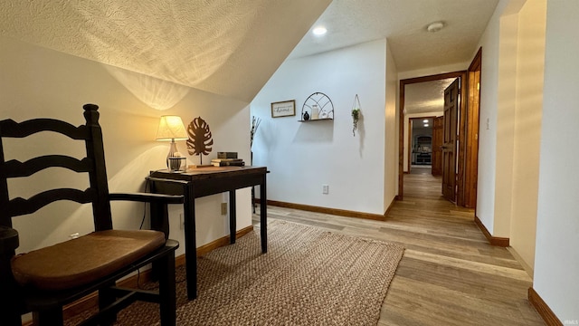 0 N State Road 450, Shoals, IN 47581 - hallway with a textured ceiling, light wood-style floors, baseboards, and recessed lighting