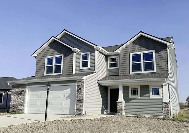 view of front of property with a garage