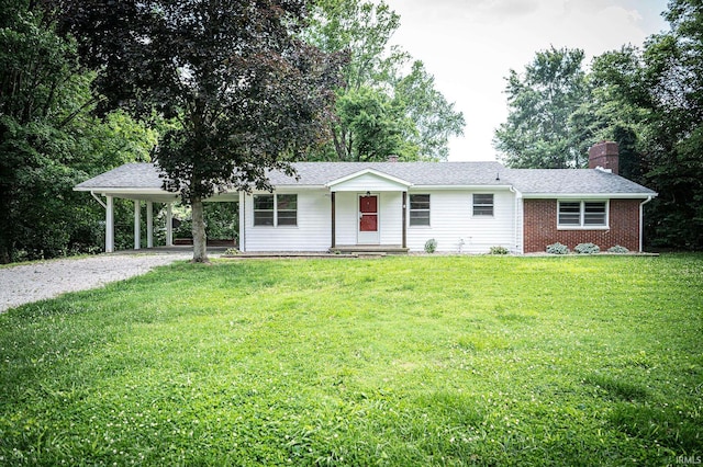 ranch-style house with a carport, covered porch, and a front lawn