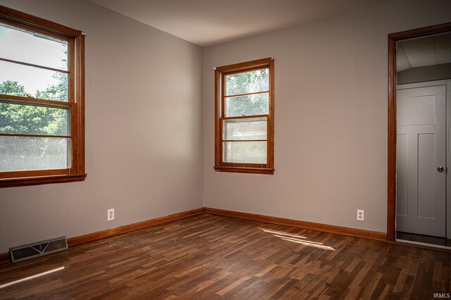 unfurnished bedroom featuring dark wood-type flooring