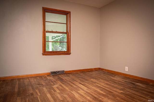 spare room featuring hardwood / wood-style flooring