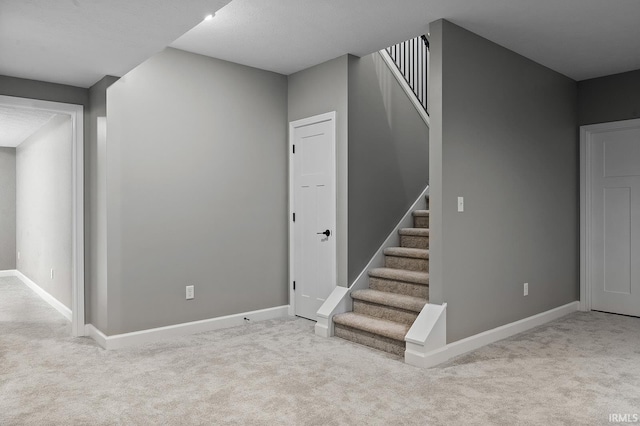 basement with light colored carpet