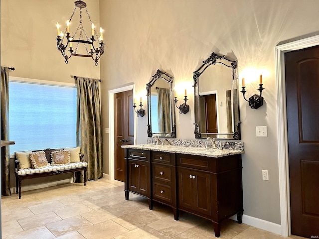 bathroom featuring vanity and a chandelier