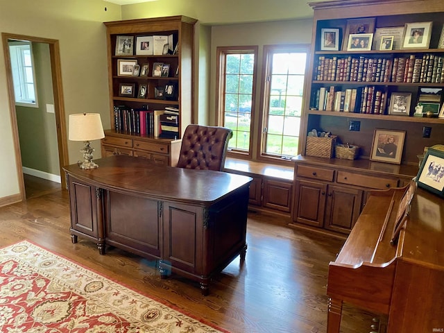 office with dark wood-type flooring