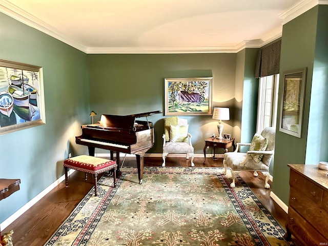 living area with hardwood / wood-style floors and ornamental molding