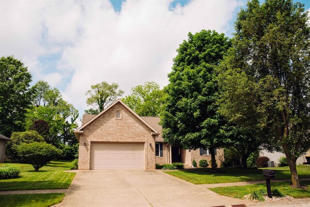 view of front of property with a garage and a front yard