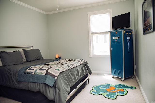 carpeted bedroom featuring baseboards, visible vents, and ornamental molding