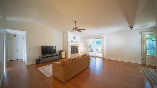 living room featuring hardwood / wood-style flooring, ceiling fan, and lofted ceiling