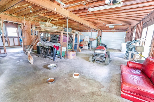 garage with a garage door opener and washer / dryer