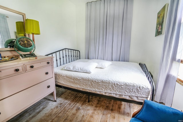 bedroom featuring dark hardwood / wood-style floors