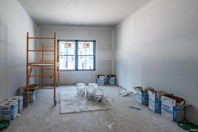 spare room with a textured ceiling