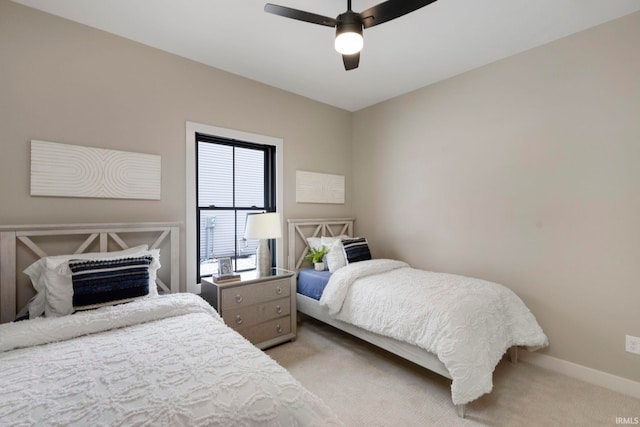 bedroom with baseboards, carpet, and a ceiling fan