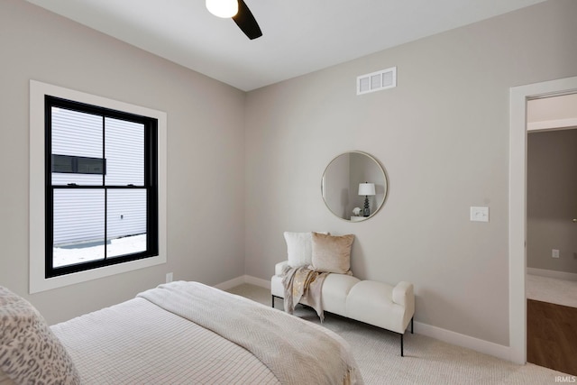 bedroom featuring visible vents, multiple windows, carpet flooring, and baseboards