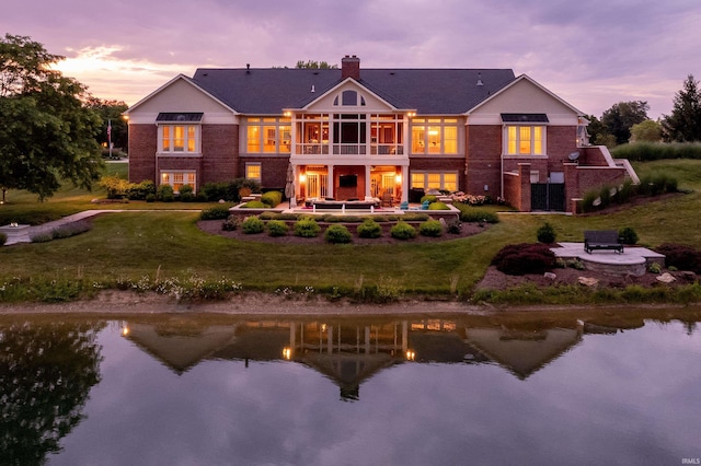 back of house with a sunroom