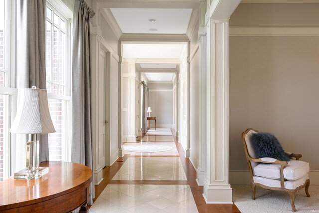 dining room with a fireplace, a chandelier, and ornamental molding