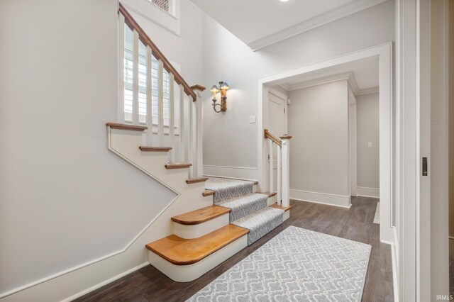 living room with french doors, dark hardwood / wood-style floors, crown molding, and a tiled fireplace