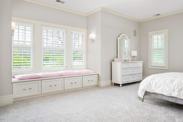 carpeted bedroom featuring crown molding