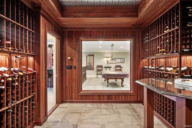 wine room featuring wooden walls, wood ceiling, and billiards