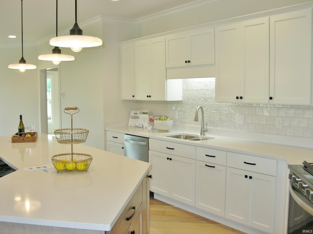 kitchen with white cabinets, a center island, sink, and stainless steel appliances