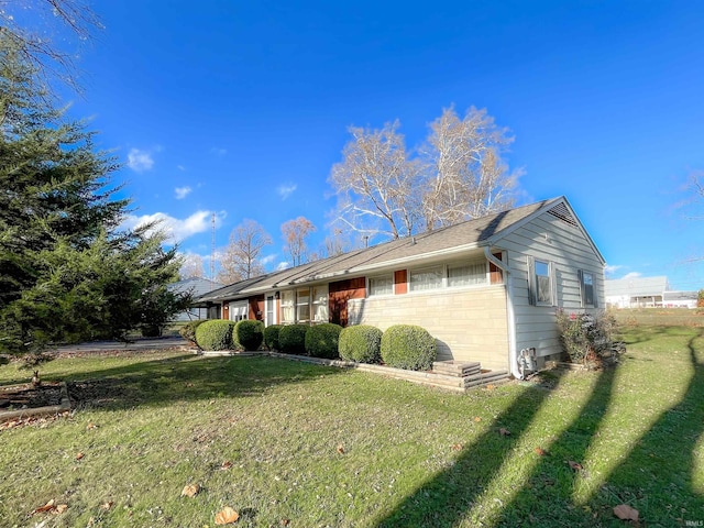 single story home featuring a front yard