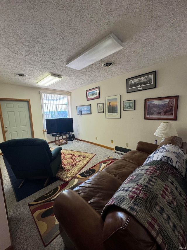 carpeted living room featuring a textured ceiling