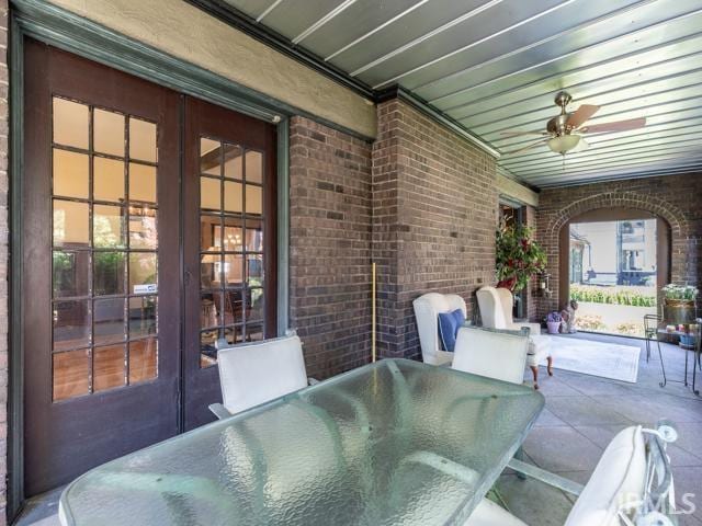 view of patio / terrace with ceiling fan and french doors