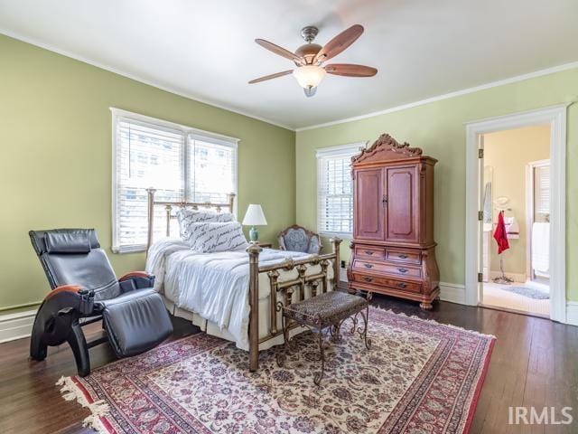 bedroom featuring ceiling fan, multiple windows, dark hardwood / wood-style flooring, and ornamental molding